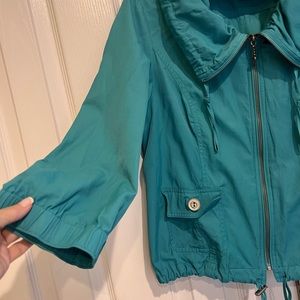 Turquoise Light weight zip up jacket.  Great condition.  Non smoker.